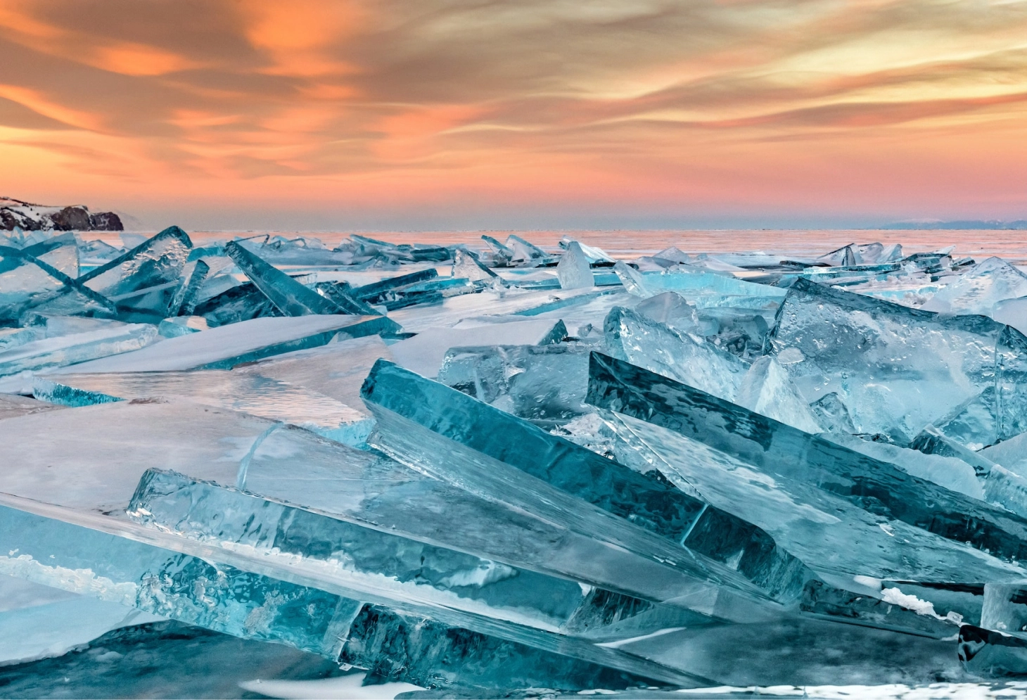 layers of ice in front of sunset