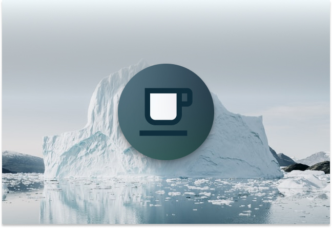 coffee mug in front of iceberg